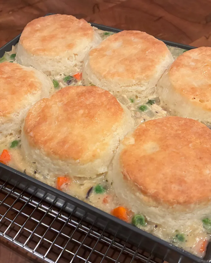 A beautiful pan of chicken pot pie and biscuit topping