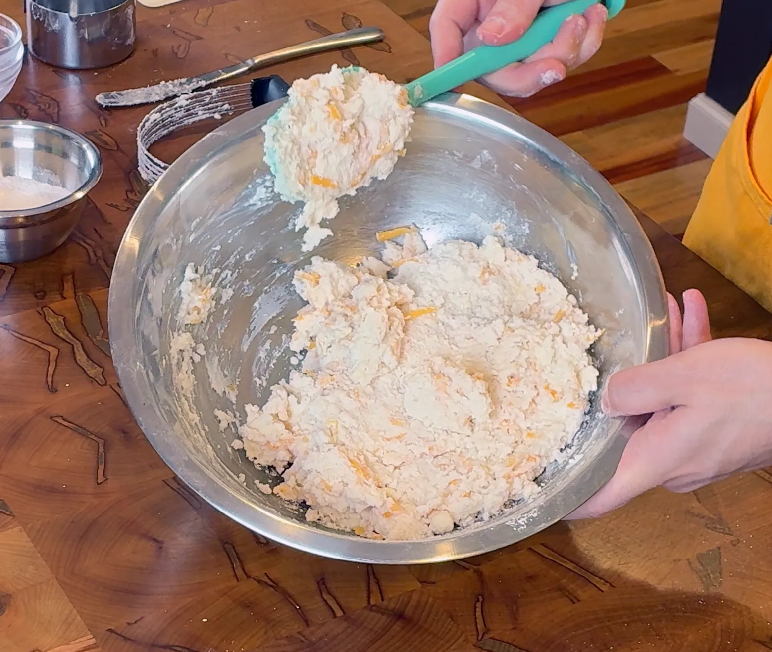 Bringing together a shaggy dough in the bowl